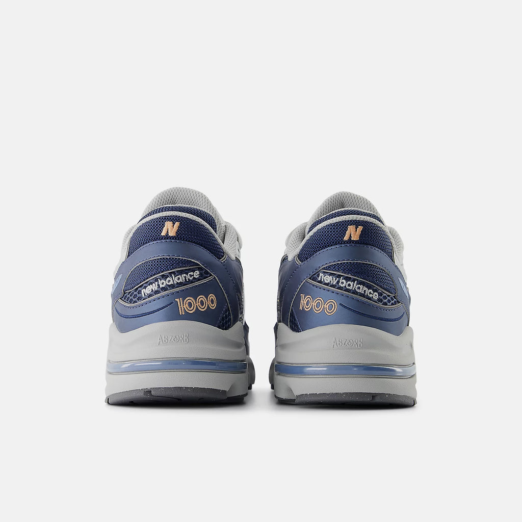 NEW BALANCE 1000P - Vintage Indigo con Light Silver Metallic y Peach Nectar